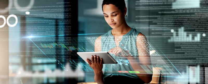 Business woman with tablet, overlay of charts