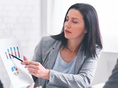 A financial planner gives a presentation to a pair of clients