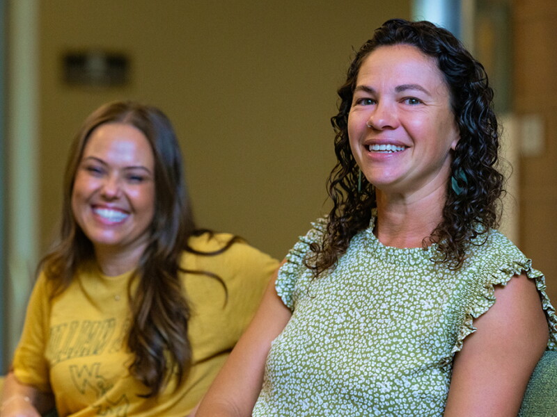 Two smiling William & Mary SOE School Counseling students