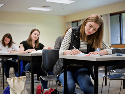 Students taking an entrance exam in a classroom