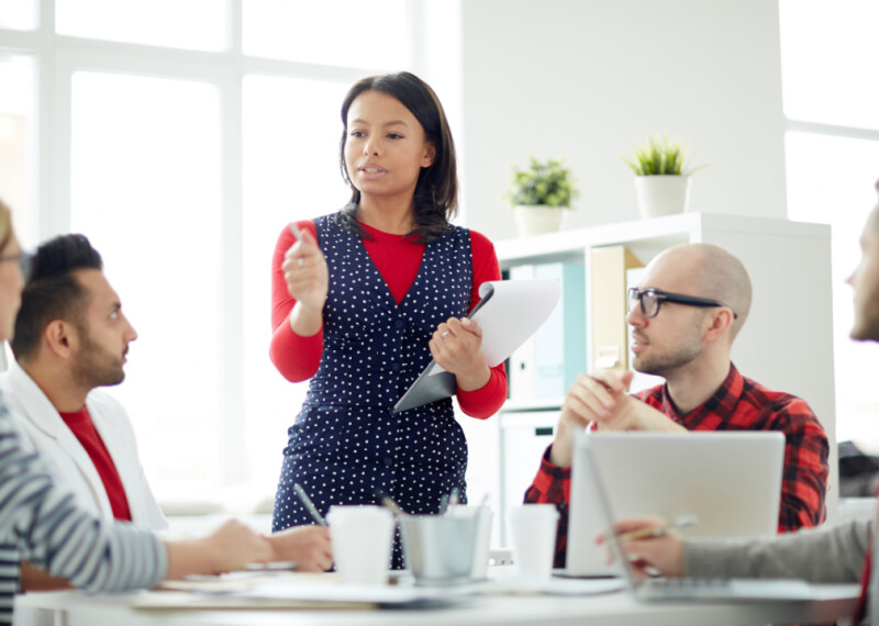 A manager leads a team meeting