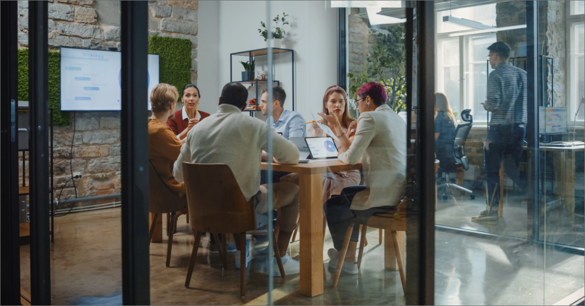 Diverse Group of Professional Businesspeople Meeting in the Modern Office Conference Room