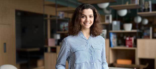 woman in striped blue shirt smiling