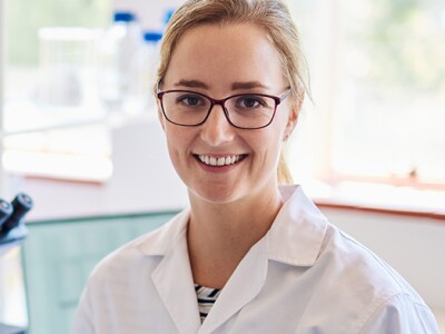Smiling biomedical engineer in her lab