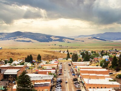Rural community with mountains in the background at sunrise