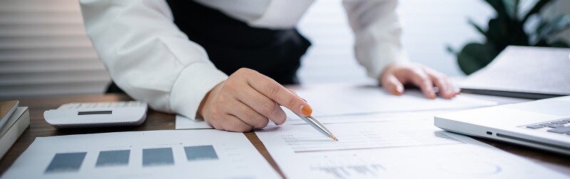 Business women checking looking over financial statements