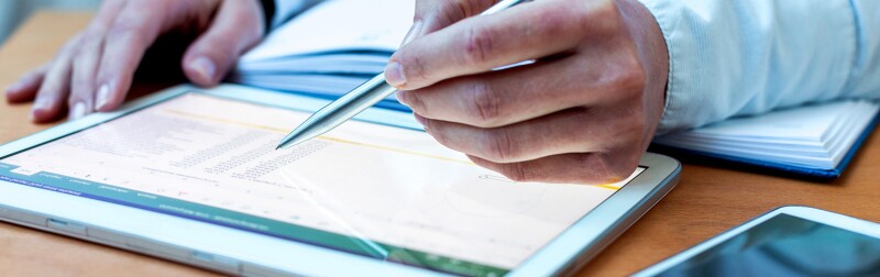 Accounting on a tablet computer, close-up