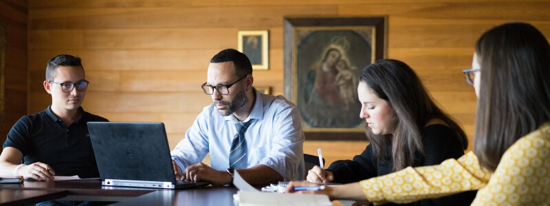 Students studying around a table