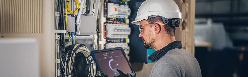 An engineer working on an electrical system.