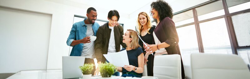 Diverse, cheerful and successful meeting with business people working, planning or brainstorming ideas strategy for project report or paper work.