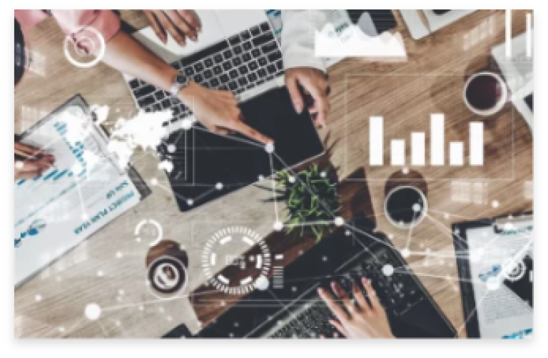Image of laptops on a table overlaid with charts and graphs