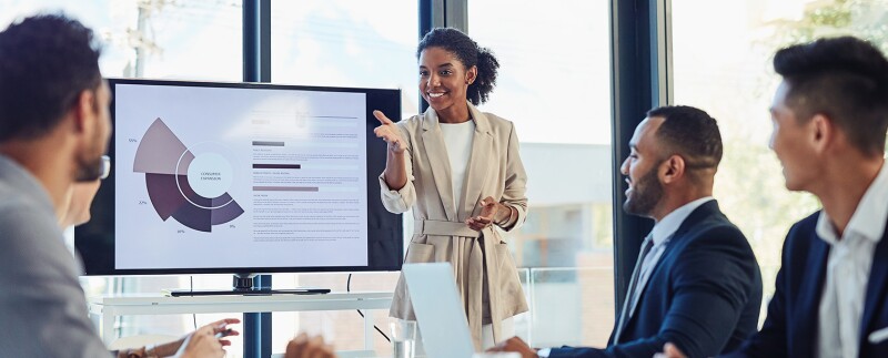 Marketing meeting, businesswoman and presentation on screen of tv in a boardroom with colleagues.