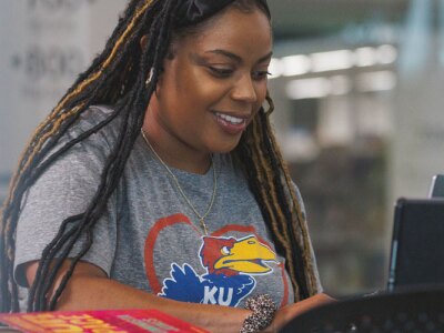 Paige Freeman poses for remote learning shots for Jayhawk Global stock at the Lawrence Public Library.