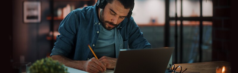 Man working on laptop at home