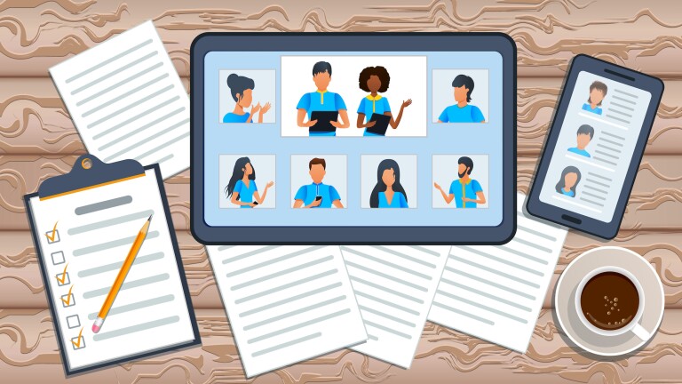 A tablet on a desk with papers around it.