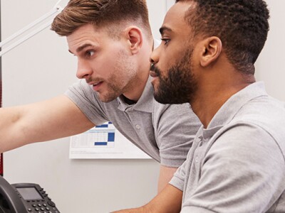 Engineers working at a computer