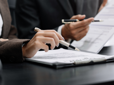 two people siging business contract