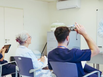Medical team attending a training session in modern hospital setting.