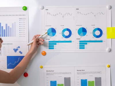 Two colleagues review business metrics together