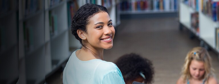 teacher with class in library