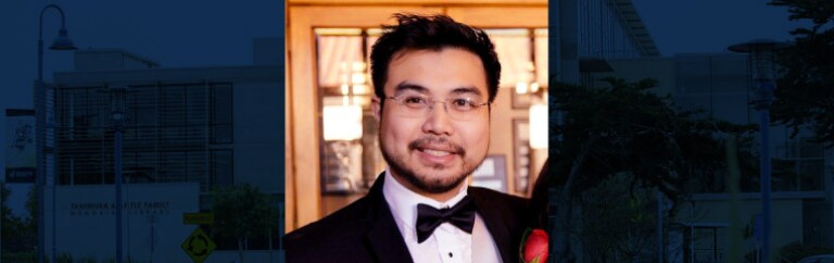 Photo of Luke Gray in a tuxedo