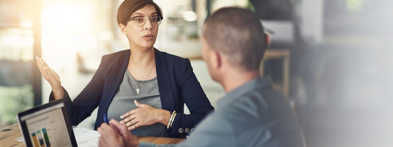 Business analysts reviewing interactive dashboard