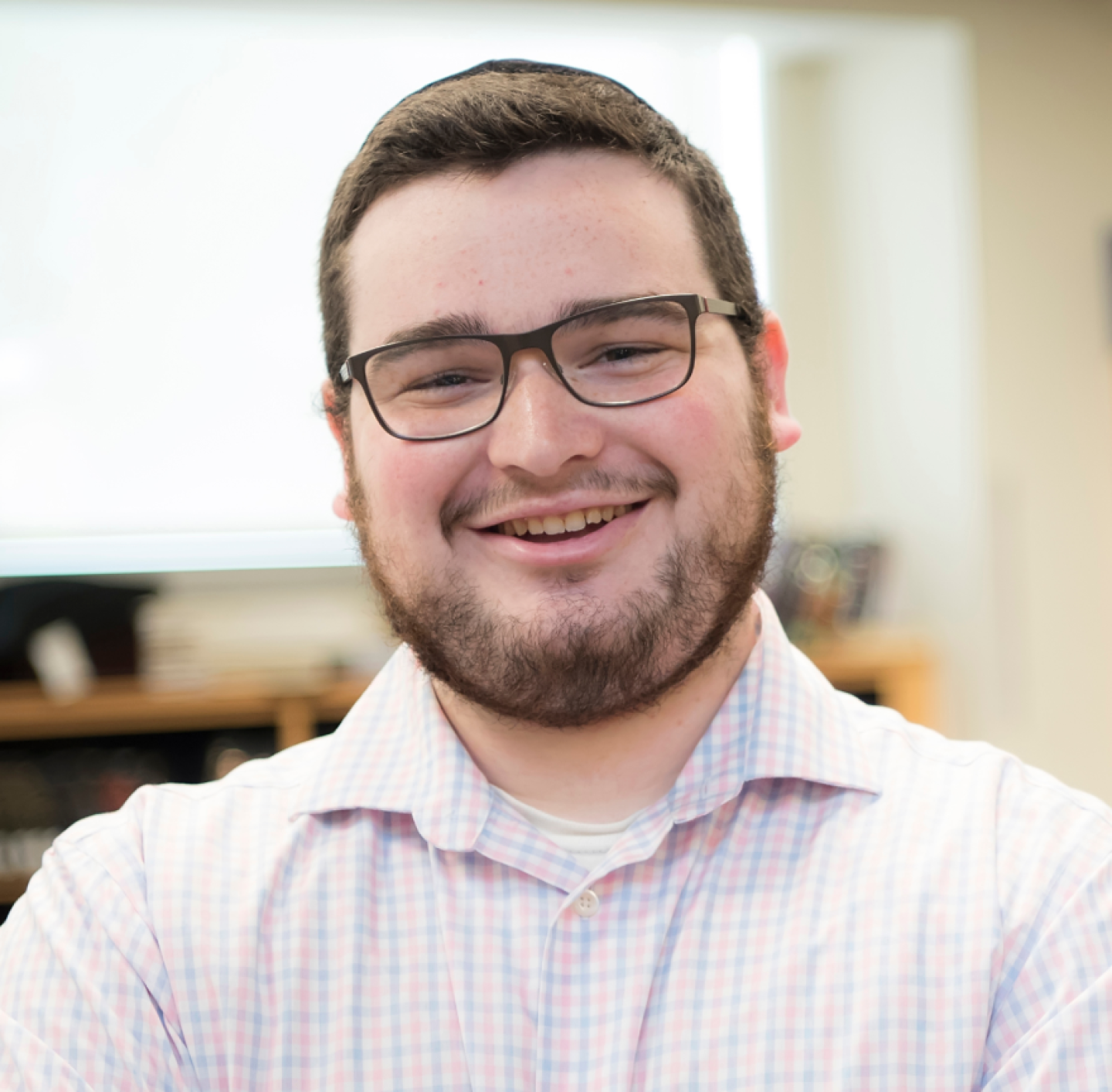 Smiling student in glasses and kippah