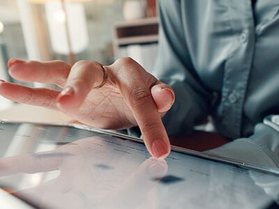Educator reviewing data on a tablet