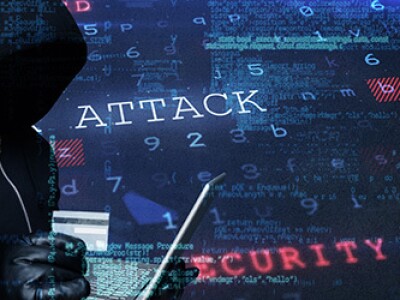 Composite image of hacker holding laptop and credir card