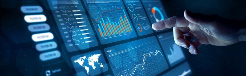 Analyst working with Financial Data and Business Analytics Dashboard on computer to make Financial Report with KPI and Metrics.