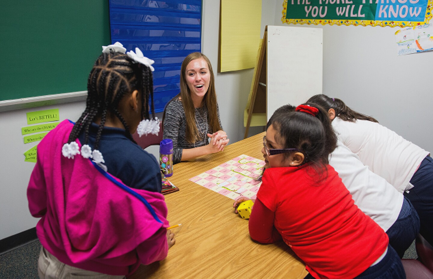 Woman working with children in classroom