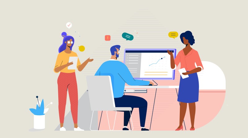 Students speaking to each other in a classroom.