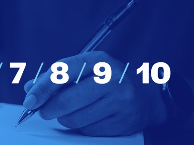 Man with pen writing a list in a notebook