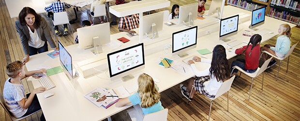 Five-kids-working-on-computer