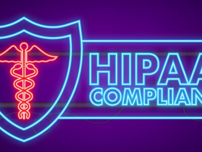 Light up sign reading, "HIPAA Compliant."