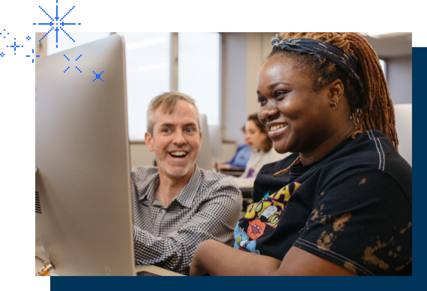 A female KU student receiving help from her male KU professor.