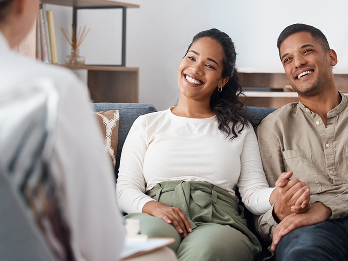Smiling couple in a marriage counseling session