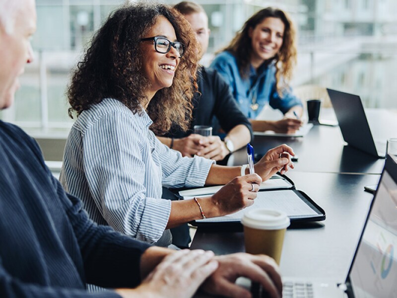 Public health professionals meeting in light-filled office