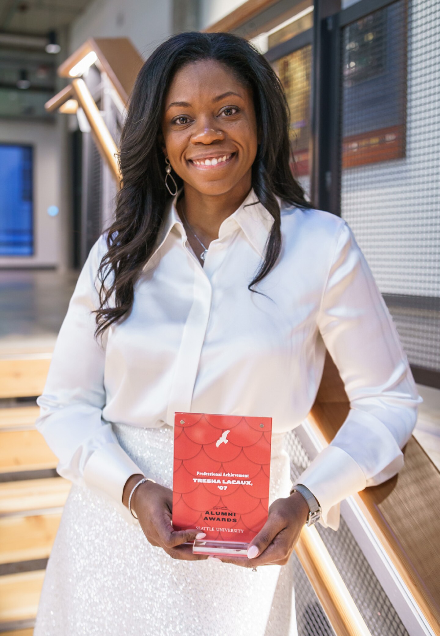 Woman at Seattle Albers awards dinner holding plaque
