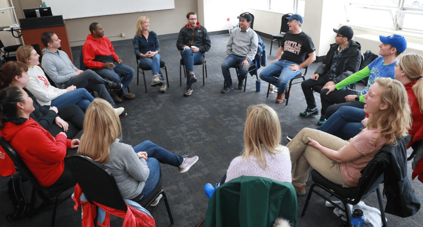 Seattle students seated in circle having a discussion