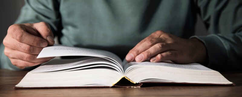 Man reading a business management book