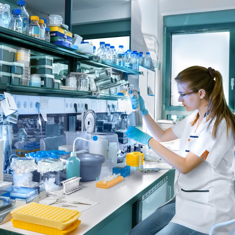 Clinical epidemiology takes samples while working in a laboratory setting