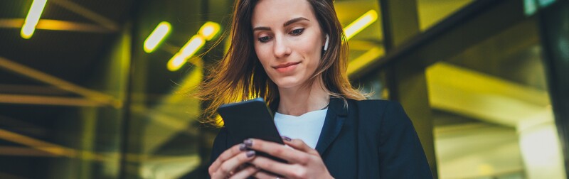 Female lawyer outside using her smart phone