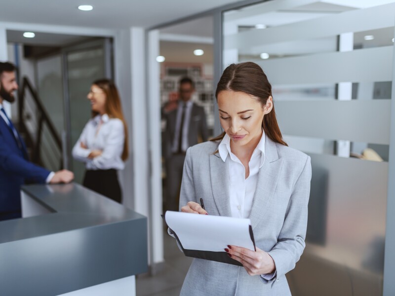 Woman looking down at documents