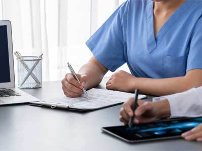 health care professionals discussing notes