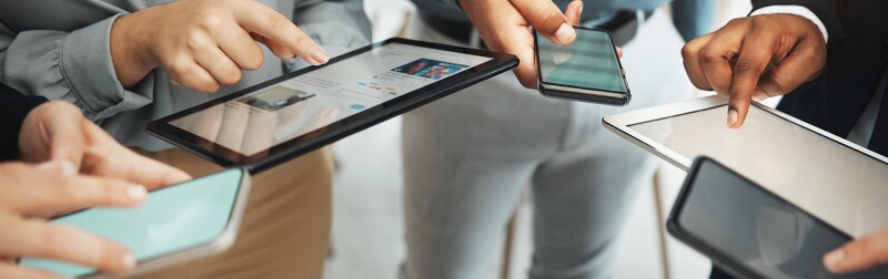 A group working on different devices viewing social media platforms