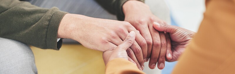 Person, holding hands with social worker