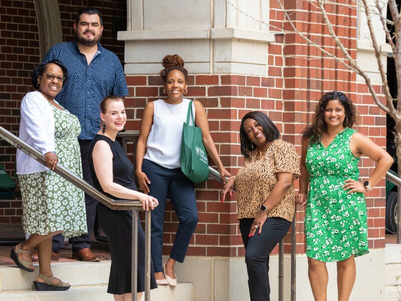 Diverse group of Tulane students on stairs outside building on campus