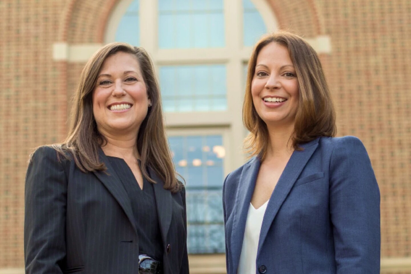 Two female students smiling during Residency Weekend