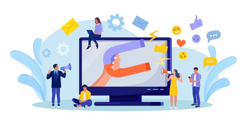 A group of people surrounding a computer